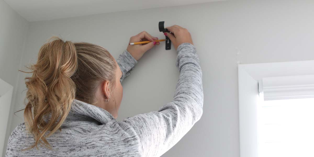 Installing curtain brackets
