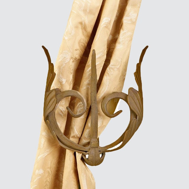Forked leaf drapery holdback